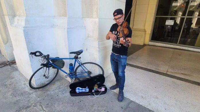 A Havana Street Musician with his Violin and Bicycle – Havana Times